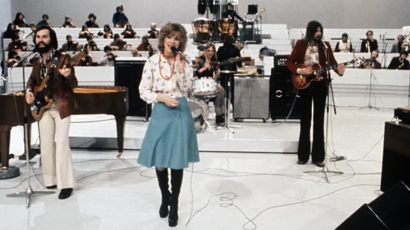 Teach-In bei einem Auftritt auf einer Studiobühne.