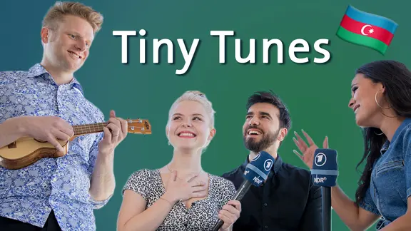 Stefan Spiegel mit einer Ukulele, dazu Carlotta, Chingiz und Laurita.