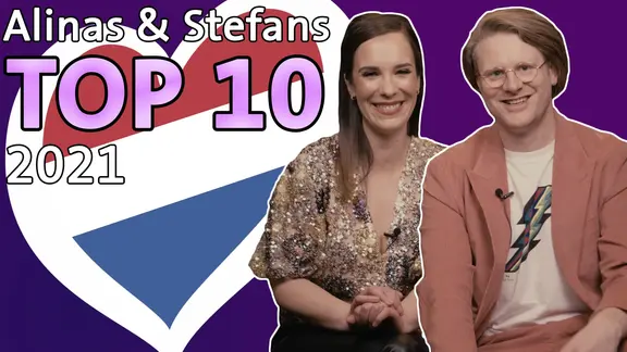 Alina Stiegler und Stefan Spiegel neben einem Herzchen mit Niederlande-Flagge.