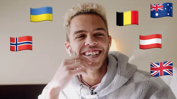 Malik Harris mit den Flaggen von Norwegen, der Ukraine, Belgien, Österreich, Australien und Großbritannien (UK).